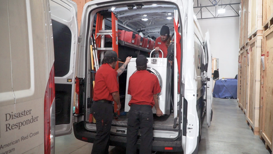 technicians loading van